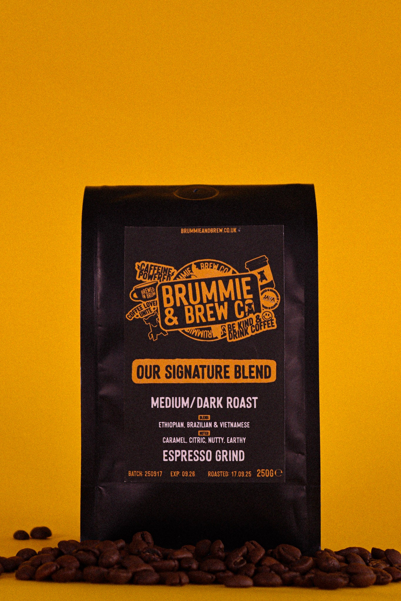 Coffee bag from Brummie & Brew Co on a yellow background with speciality coffee beans.